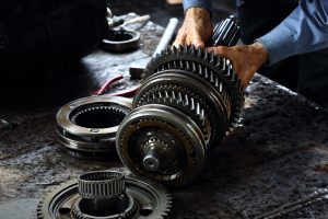 Mechanic hands holding transmission | Temple Hills, MD