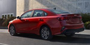 rear left angle of a red 2024 Kia Forte | Temple Hills, MD